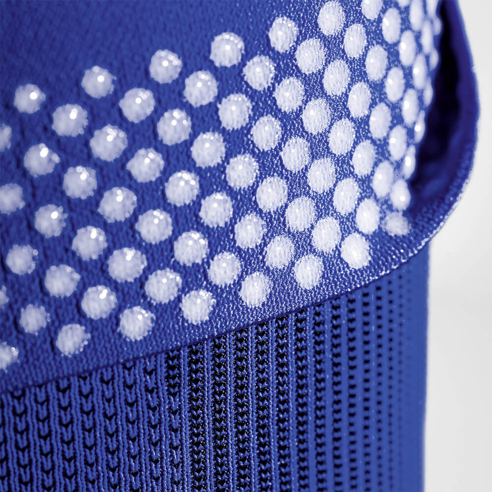 Close-up of the silicone-dotted gripping zones found on Bauerfeind's Sports Compression Knee Support NBA Mavericks Edition.