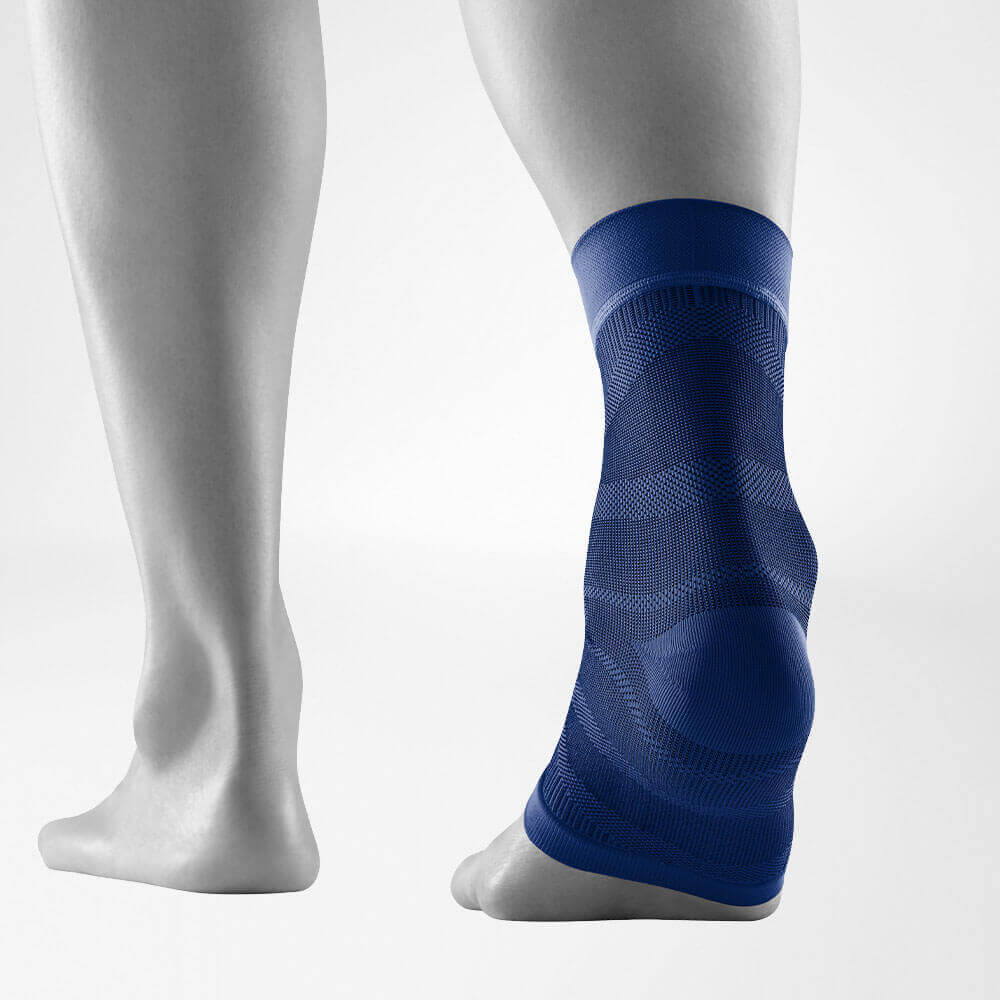 Person wearing a blue ankle support brace for injury recovery and joint stability.