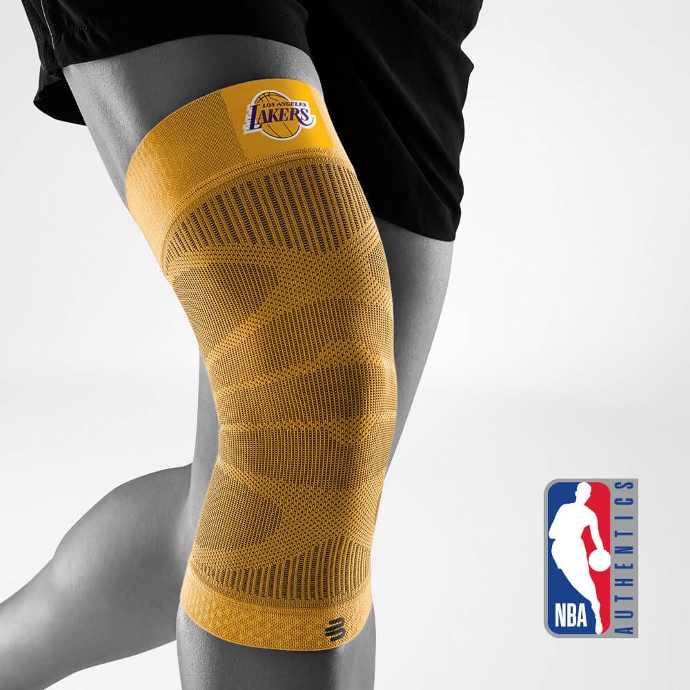 Bauerfeind's Sports Compression Knee Support NBA Lakers Edition with NBA Authentics logo in the background.