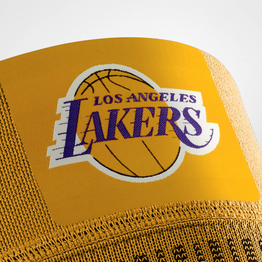 Close-up of Los Angeles Lakers logo on the front of Bauerfeind's Sports Compression Knee Support NBA Lakers Edition.