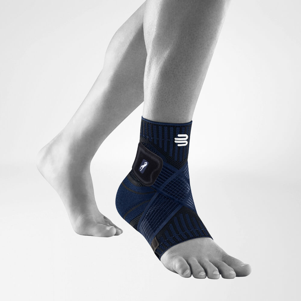 Person wearing a blue ankle brace with compression support.