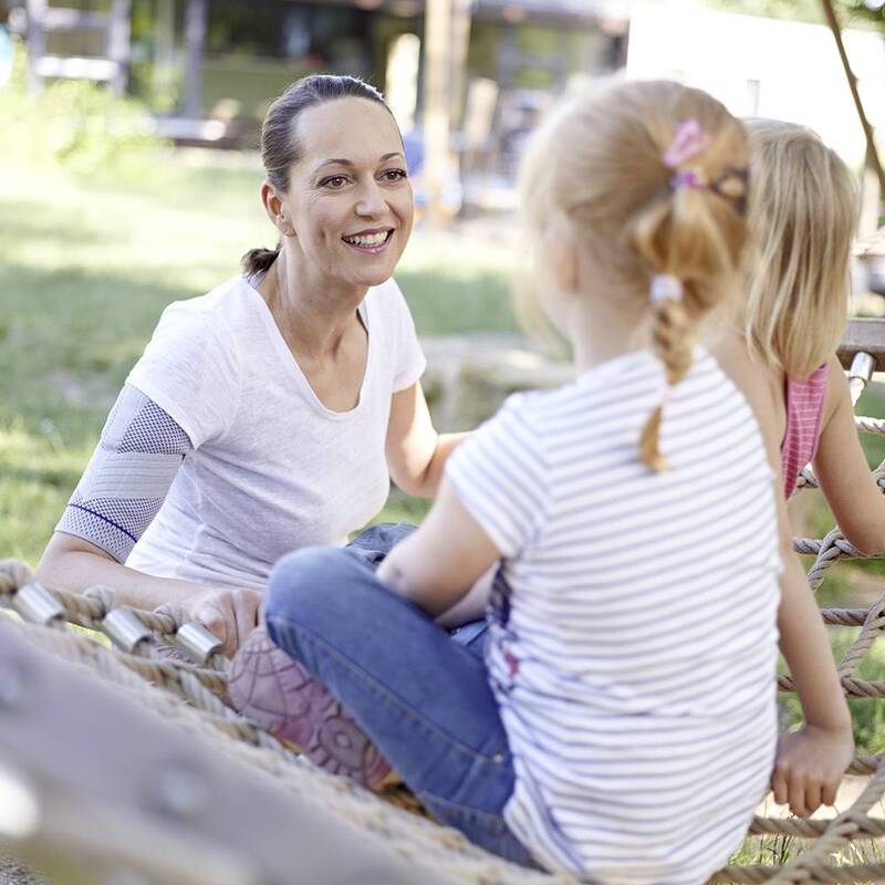 Image of Grandfather and Granddaughter Enjoying Outdoor Playtime Together with EpiTrain