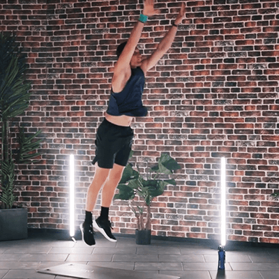 Olympic Gold Medalist Thomas Röhler performing the burpee exercise in a fitness studio while wearing Bauerfeind's Sports Wrist Strap.