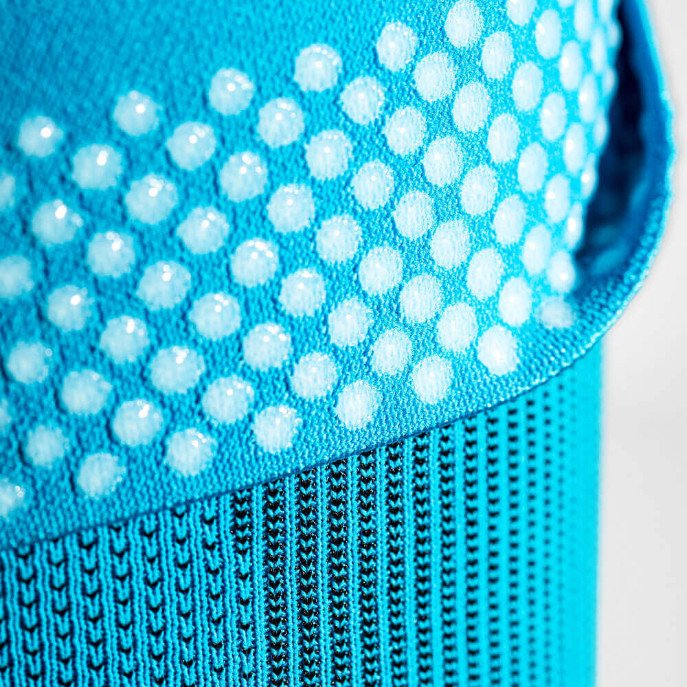 Image of white silicone grip dots pattern of the Compression Elbow Support