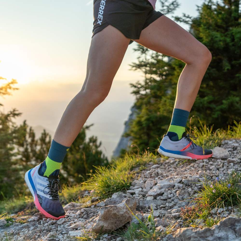 Close-up image of a runner wearing Trail Run Midcut Socks