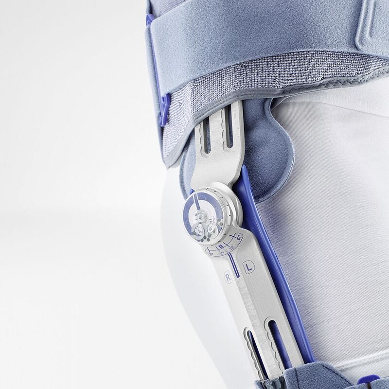 Close-up view of a modern prosthetic knee joint mechanism highlighting its intricate design and calibration markings.