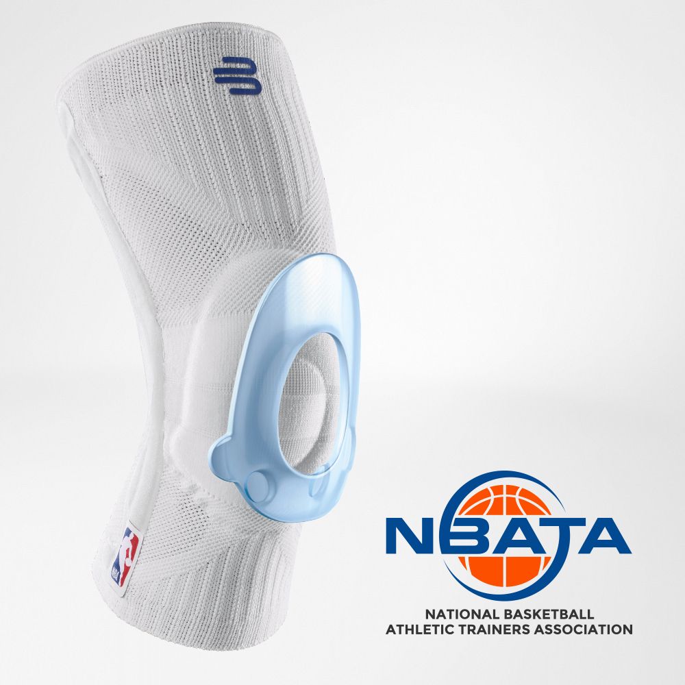 Close-up of a person wearing a black knee brace with an NBA logo for support during sports activities.