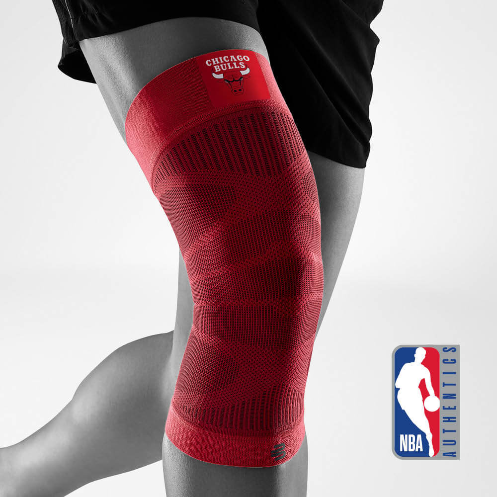 Bauerfeind's Sports Compression Knee Support NBA Bulls Edition with NBA Authentics logo in the background.