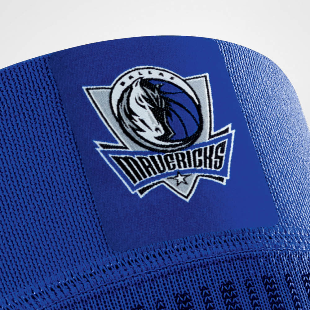 Close-up of Dallas Mavericks logo on blue basketball jersey fabric