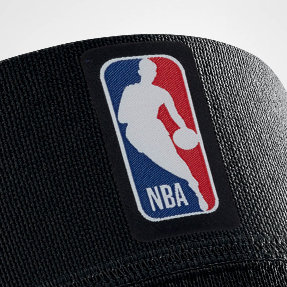 Close-up of NBA logo on black fabric