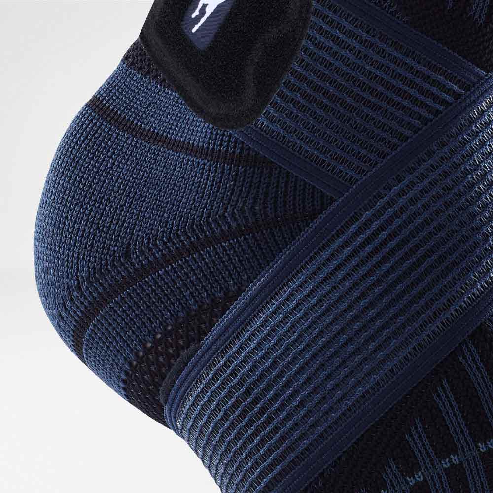 Close-up of a blue compression ankle brace providing support and stabilization