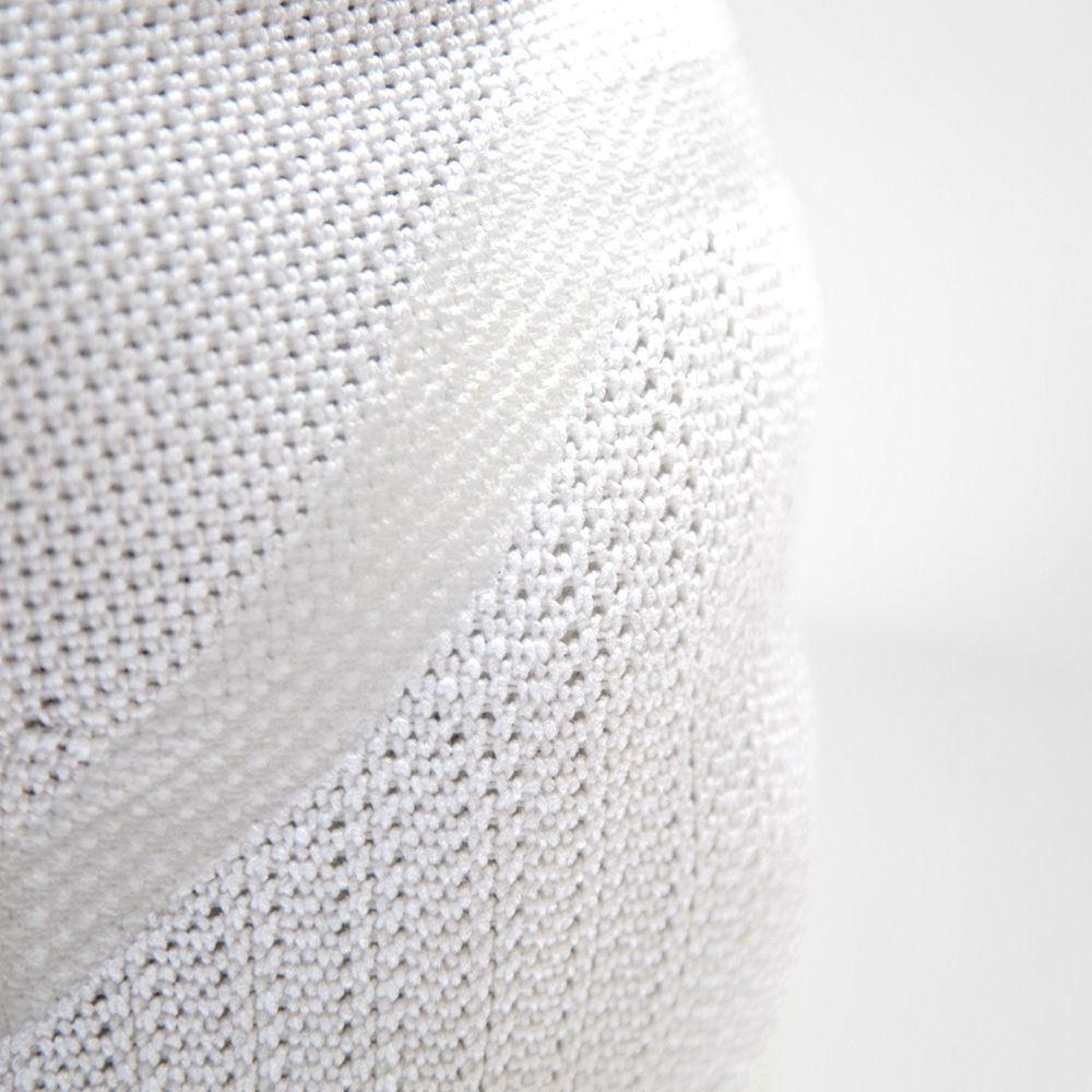 Close-up of white textured fabric with a unique wave pattern