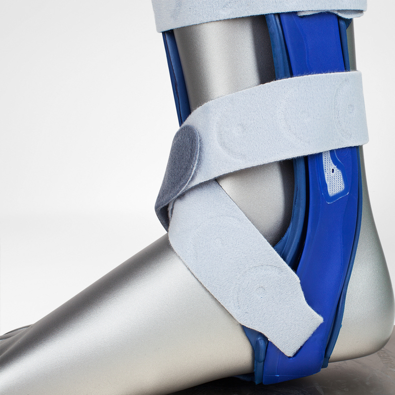 Ankle stirrup for injury support, featuring velcro straps and a blue stabilization elements