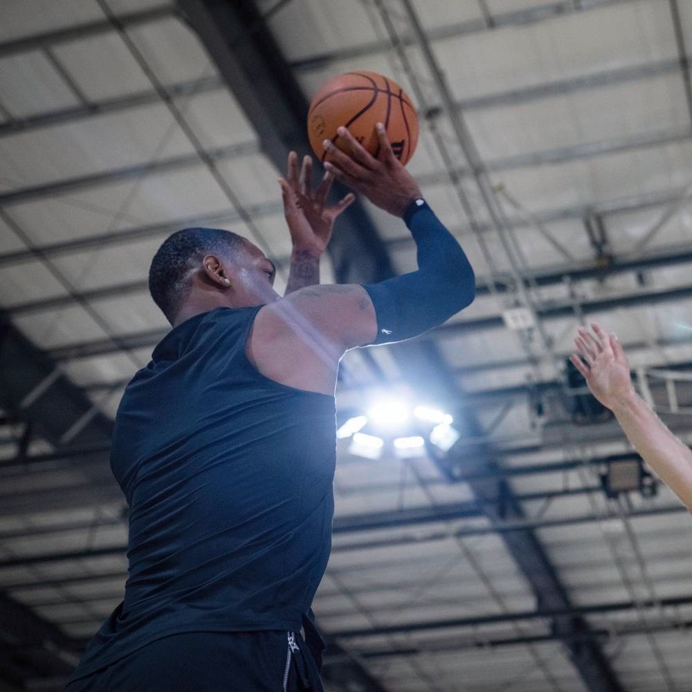 Image of basketball player shooting wearing the Compression Sleeves Arm Dirk