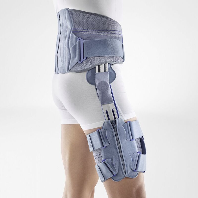 Side view of a person wearing a modern blue hip brace designed for orthopedic support, showing the adjustable straps and structural padding against a neutral background.