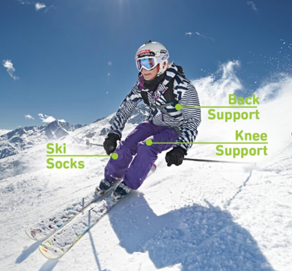 Female athlete performing the spring in place exercise while at home wearing Bauerfeind's Ski Ultralight Compression Socks.