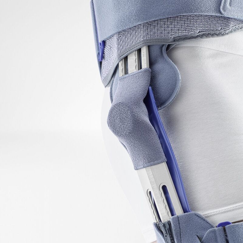 Close-up view of a modern prosthetic knee joint mechanism highlighting its intricate design and calibration markings.