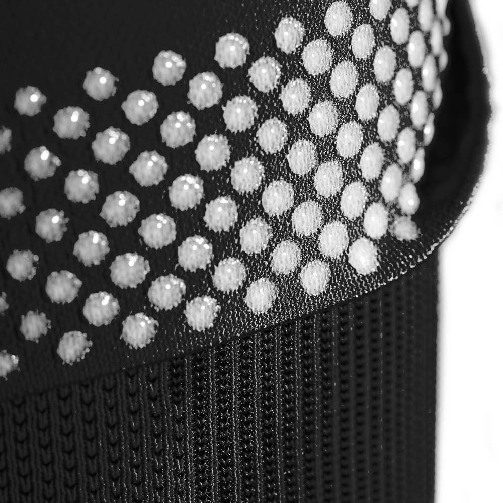 Close-up of black fabric with white dot pattern and ribbed texture